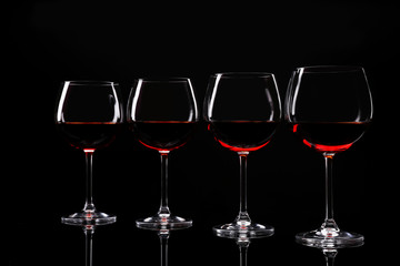 Glasses of wine isolated on black