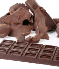 Cracked chocolate bar isolated on white