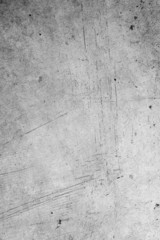 Grey scratched vertical concrete wall