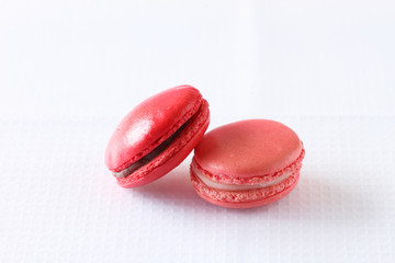 colourful french macaroons on white background