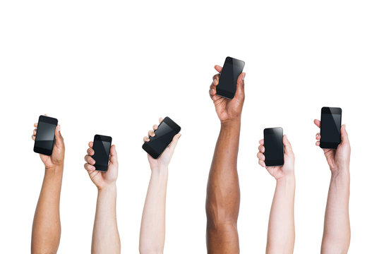 Arms Raising Smartphones and One Standing Out