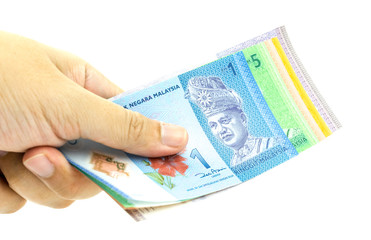 Hand holding Malaysia Ringgit Currency Bank Notes