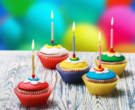 Birthday cupcakes with burning candles