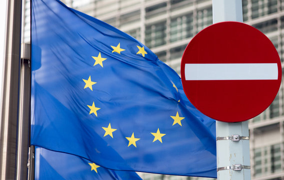 No entry sign in front of EU flag
