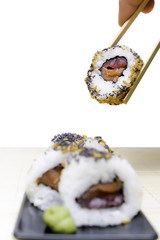 holding sushi