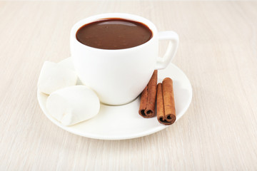 Cup of hot chocolate on table, close up