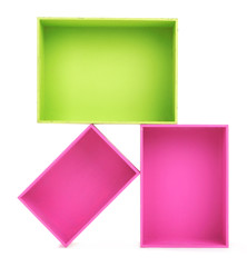 Fototapeta premium Multicoloured wooden boxes on white background isolated