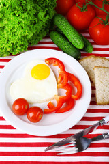 Scrambled eggs with vegetables served