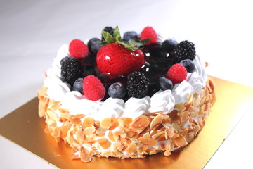 piece of blueberry cheese cake on a tiny plate, the topping is