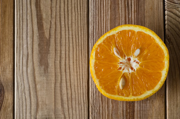 Cut Orange From Above on Wood
