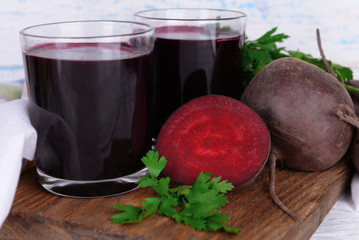Glasses of fresh beet juice and vegetables
