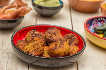 Tapas with falafel, cured ham, green peppers