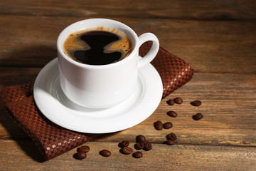 Cup of coffee on wooden background