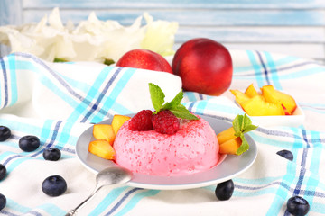 Heart shaped cake with fruits and berries on plate on