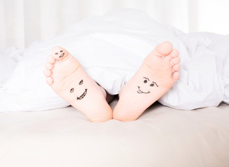 bare feet with smiley faces