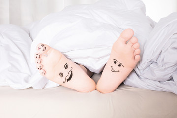 Obraz na płótnie Canvas bare feet with smiley faces