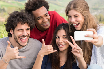 Fototapeta premium Friends Taking A Selfie With Mobile Phone