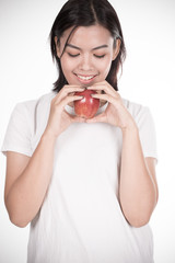 Smiling woman with apple isolated on white