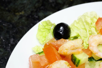 The image of salad with the shrimps
