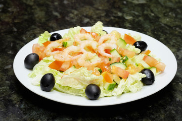 The image of salad with the shrimps