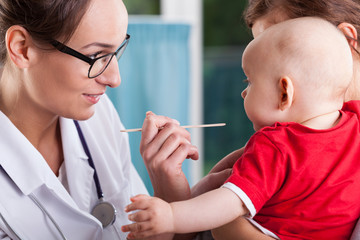 Mother with baby during examination