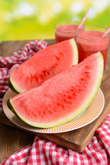 Juicy watermelon on table on bright background