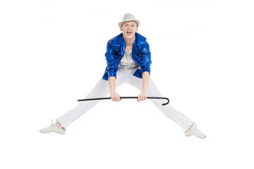 Man dancer in the blue sparkle suit and white trousers jumping