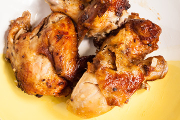 Grilled chicken on dish.