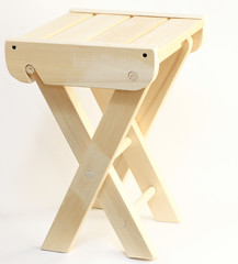 Folding wooden chair on a white background isolated