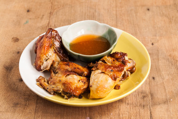 Grilled chicken on dish.