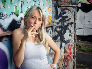 Addicted young girl smoking cigarette