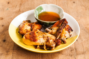 Grilled chicken on dish.