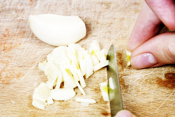 Fototapeta na wymiar Chopping the Garlic