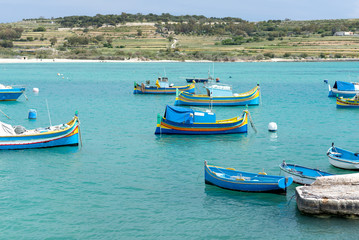 Fototapeta na wymiar Colored fishing boats in Malta horizontal