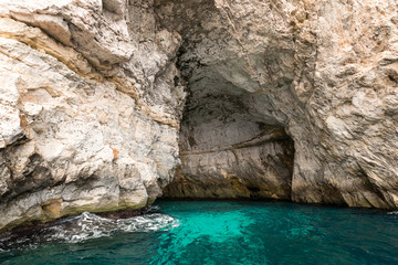 Caves and cliffs at the coast of Gozo Island entrance