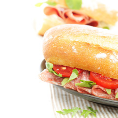 Snack food sandwich with salami and tomatoes
