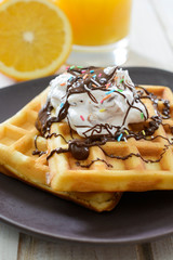 Sweet waffels with cream and chocolate