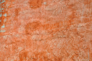 Textur - orangerote Hausfassade