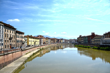 Fototapeta na wymiar Panorama of Arno river which crosses the city of Pisa