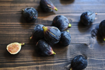 Fresh figs on a rustic dark wooden table horizontal