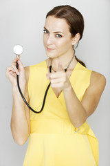 Fototapeta na wymiar Female doctor pointing