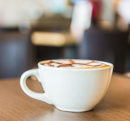 Coffee cup in coffee shop interior
