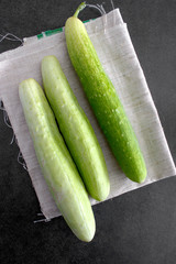 fresh cucumbers on a wooden table