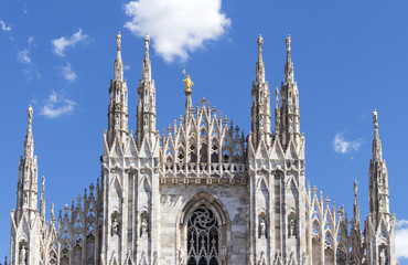 Fototapeta premium Duomo of Milan,Italy.Cathedral.Gold statue of Virgin Mary.