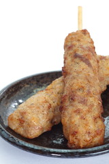 Deep fried chicken  knees tendon with skewer