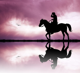 Naklejka premium man on horse on river