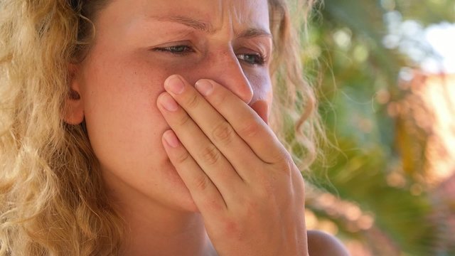 Female Begins to Cough after Smoking Cigarette.