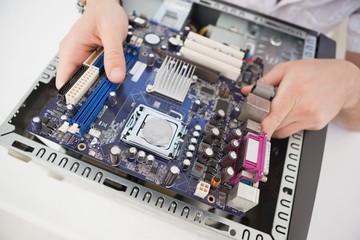 Computer engineer working on broken cpu