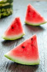 Ripe watermelons on table on the wooden background