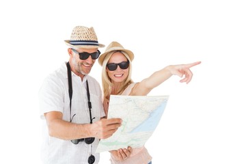 Happy tourist couple using map and pointing